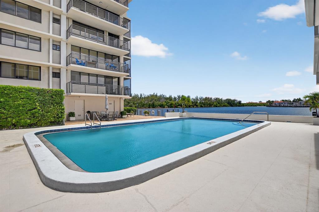 850 Northeast Spanish River Boulevard, Unit 33 Boca Raton, FL 33431 - Photo 24 of 37 a view of swimming pool with outdoor space and seating area