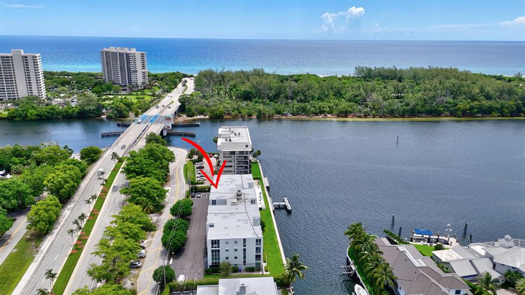 850 Northeast Spanish River Boulevard, Unit 33 Boca Raton, FL 33431 - Photo 33 of 37 an aerial view of house with yard swimming pool and outdoor seating