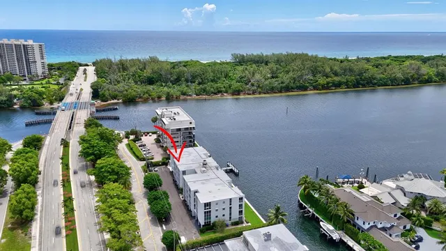 an aerial view of a house with a lake view