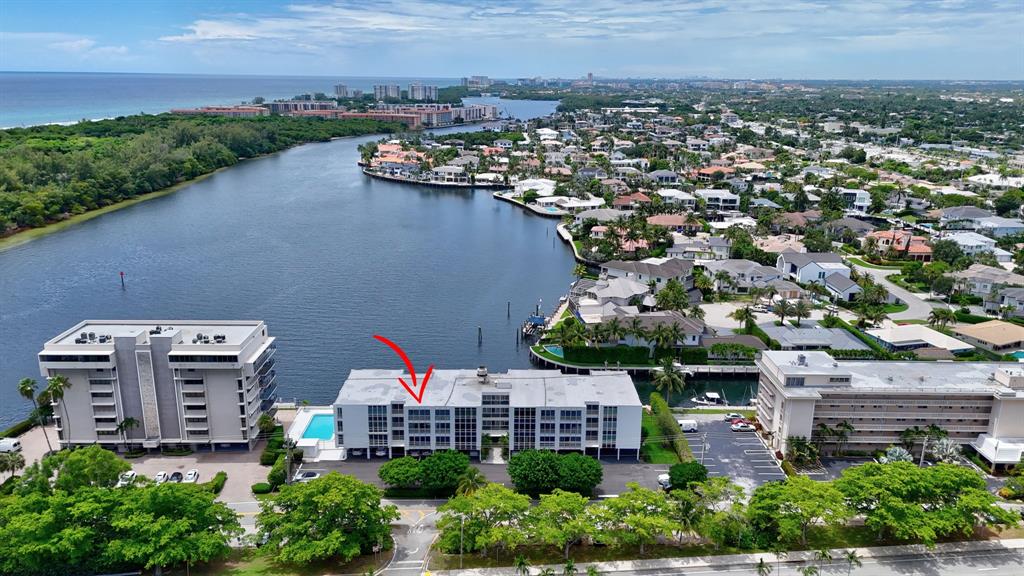 850 Northeast Spanish River Boulevard, Unit 33 Boca Raton, FL 33431 - Photo 35 of 37 an aerial view of a house with a lake view