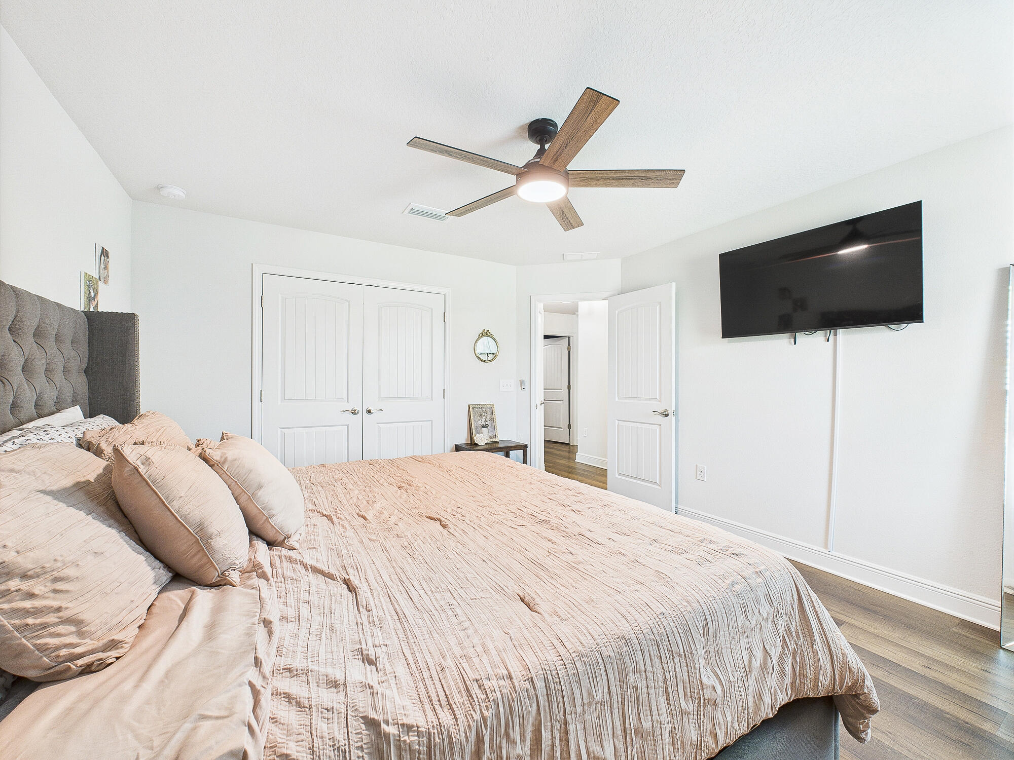 5740 Marigold Loop Crestview, FL 32539 - Photo 22 of 47 a bedroom with a bed and a flat screen tv
