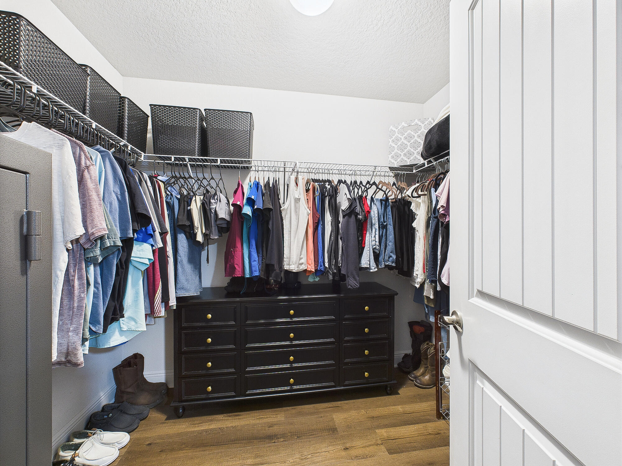 5740 Marigold Loop Crestview, FL 32539 - Photo 25 of 47 a view of walk in closet with clothes