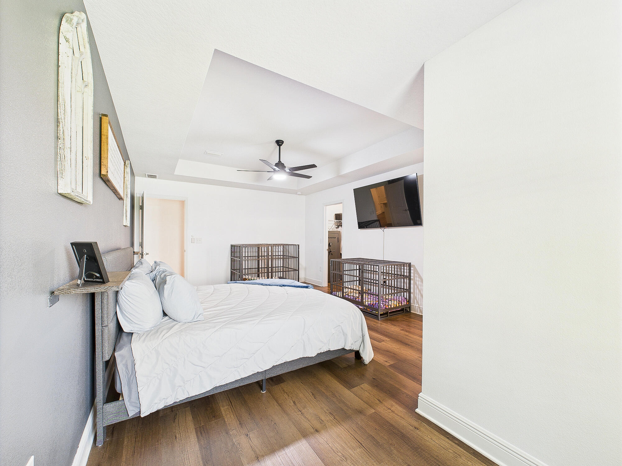 5740 Marigold Loop Crestview, FL 32539 - Photo 26 of 47 a bedroom with a bed and a flat screen tv
