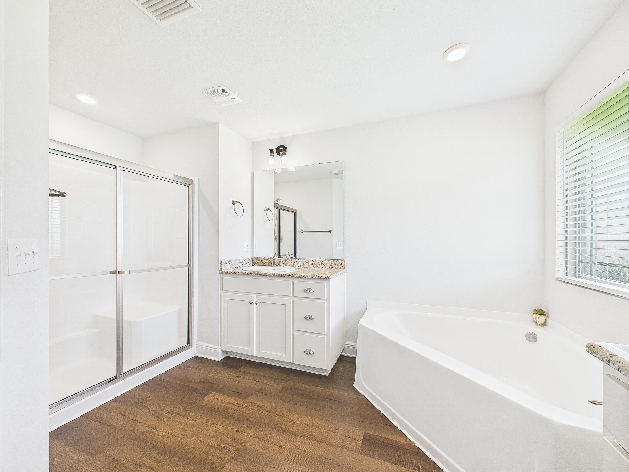 5740 Marigold Loop Crestview, FL 32539 - Photo 28 of 47 a spacious bathroom with a tub shower and a sink