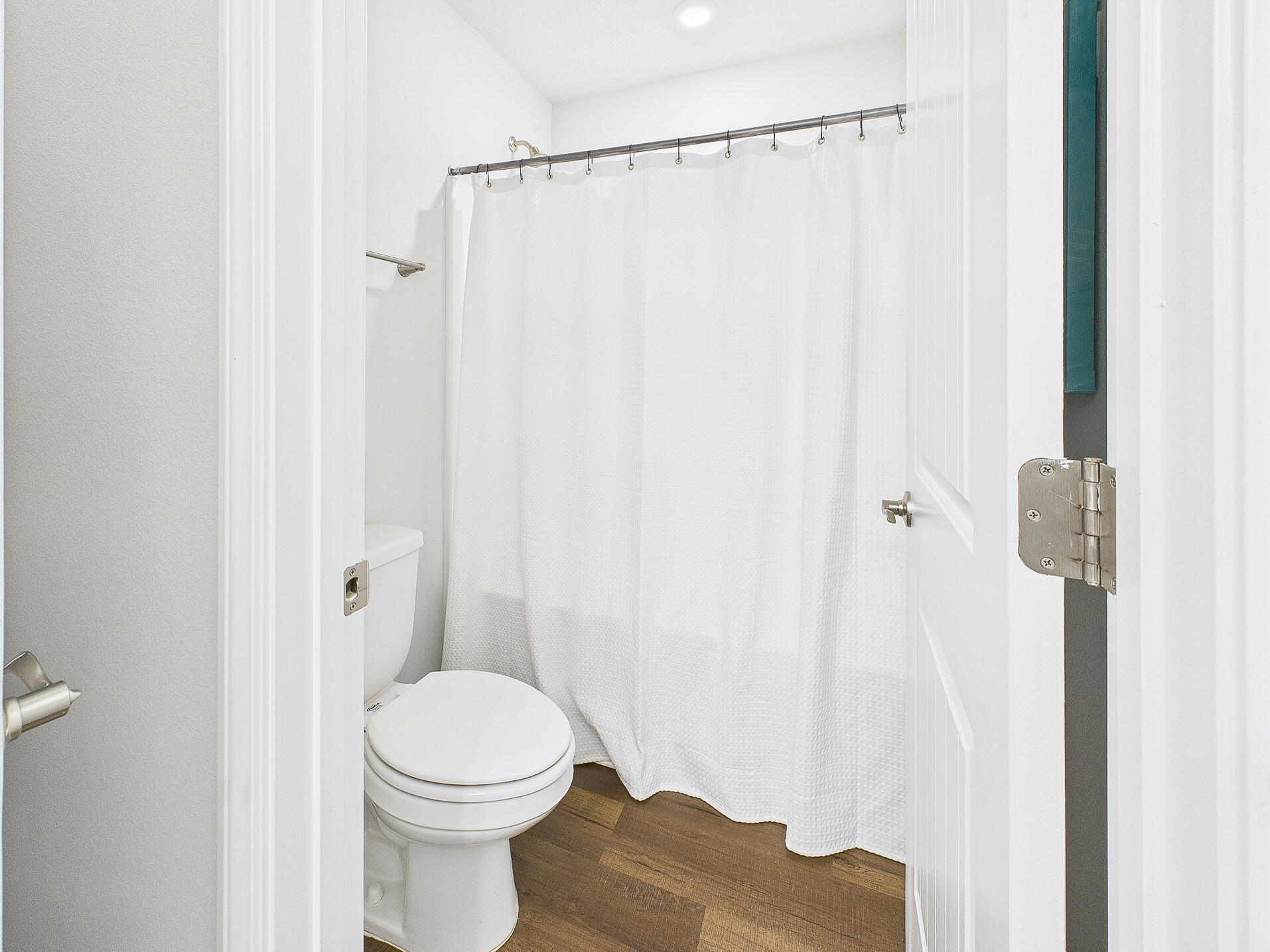 5740 Marigold Loop Crestview, FL 32539 - Photo 33 of 47 a white toilet sitting next to a shower curtain