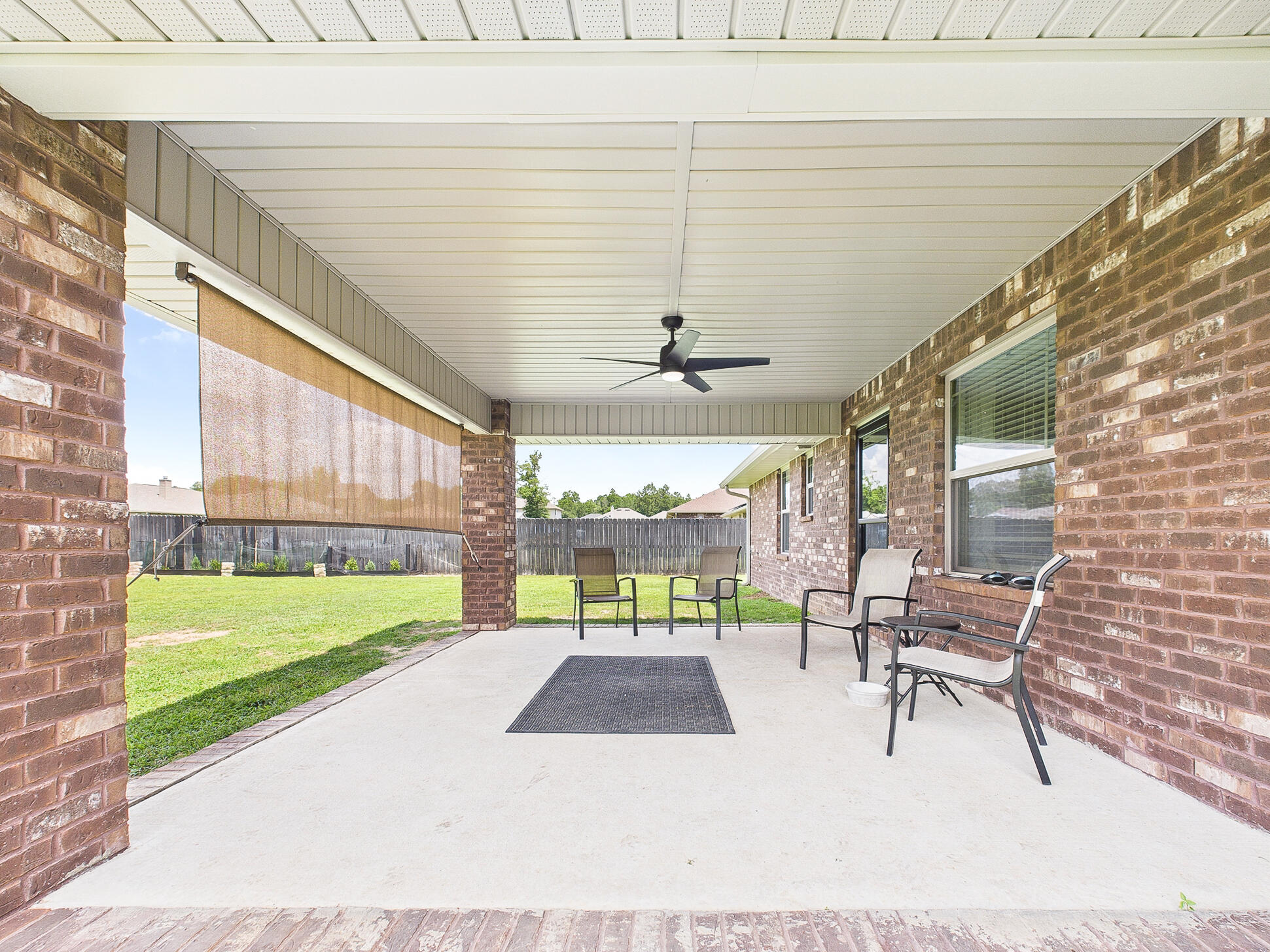 5740 Marigold Loop Crestview, FL 32539 - Photo 39 of 47 a view of an chairs and table in the patio