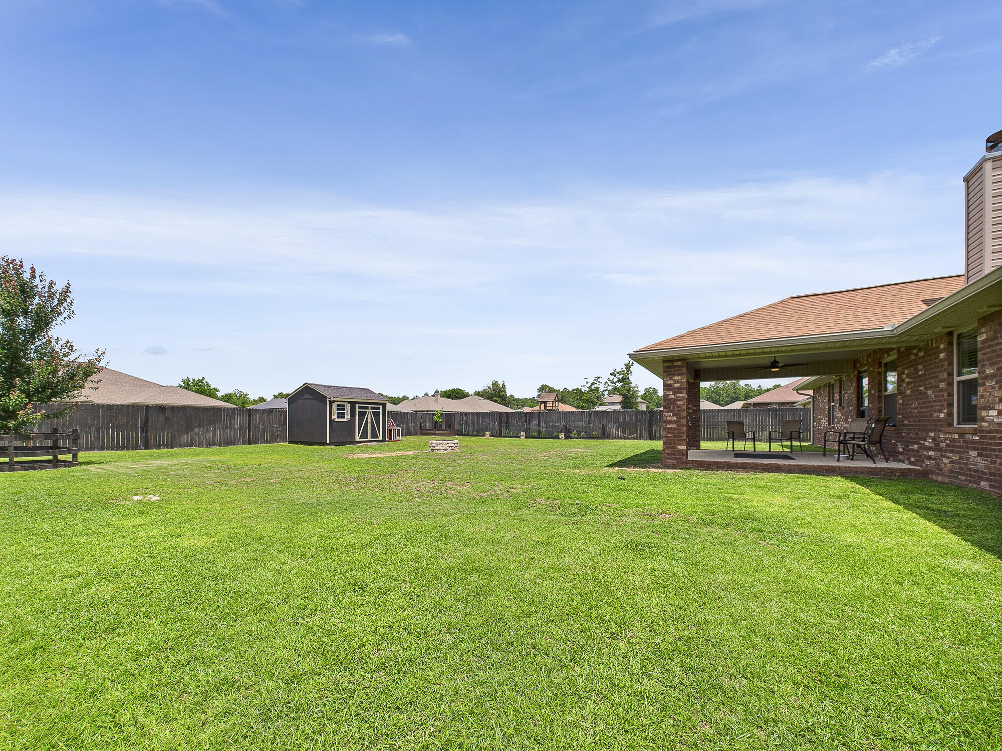 5740 Marigold Loop Crestview, FL 32539 - Photo 40 of 47 a view of a house with a big yard and large trees
