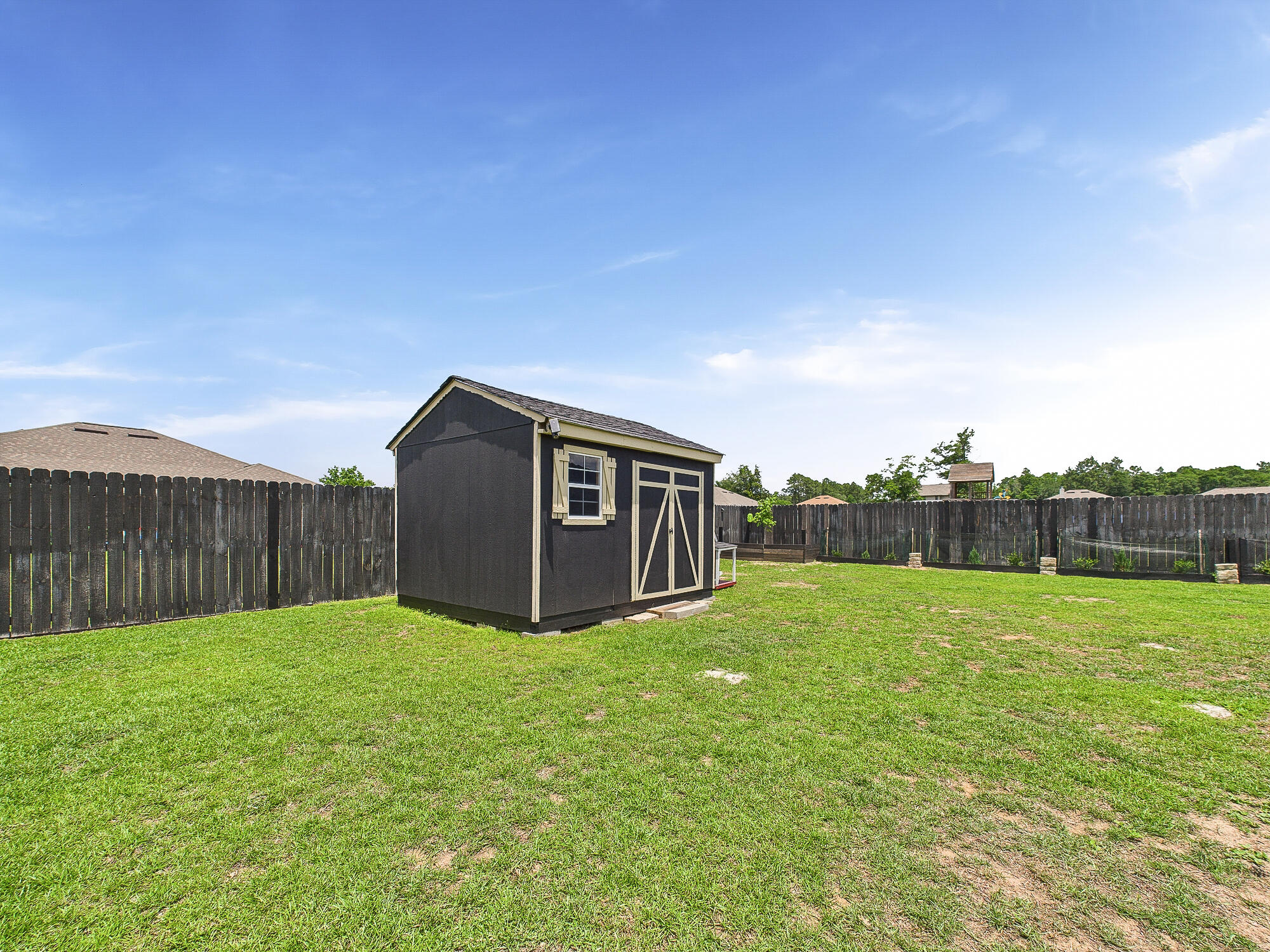 5740 Marigold Loop Crestview, FL 32539 - Photo 41 of 47 a view of a backyard with a fence