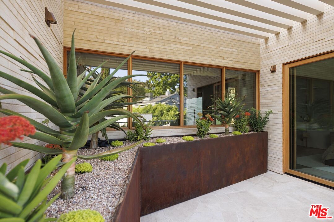 12128 Viewcrest Road Studio City, CA 91604 - Photo 14 of 24 a view of a potted plant in front of a door