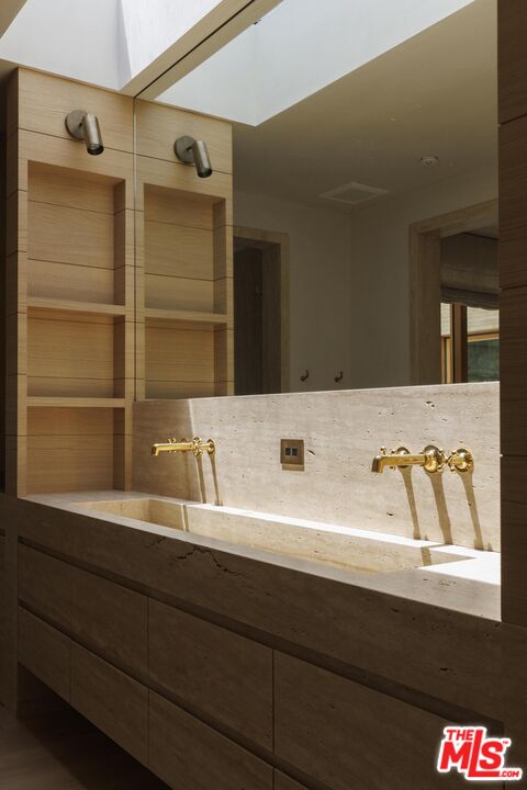 12128 Viewcrest Road Studio City, CA 91604 - Photo 16 of 24 a bathroom with a sink and a mirror