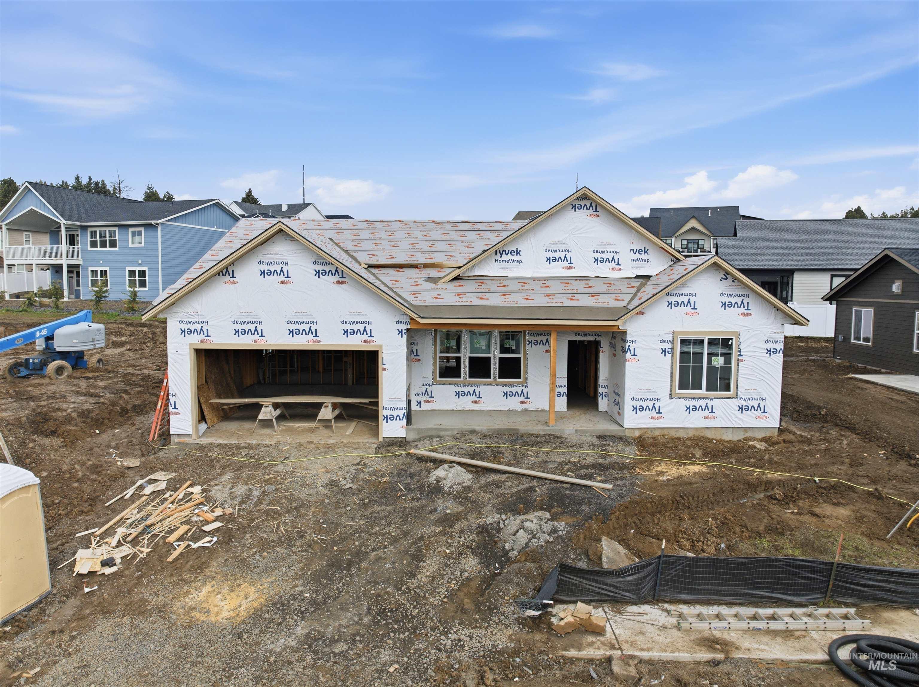 Property under construction with a garage