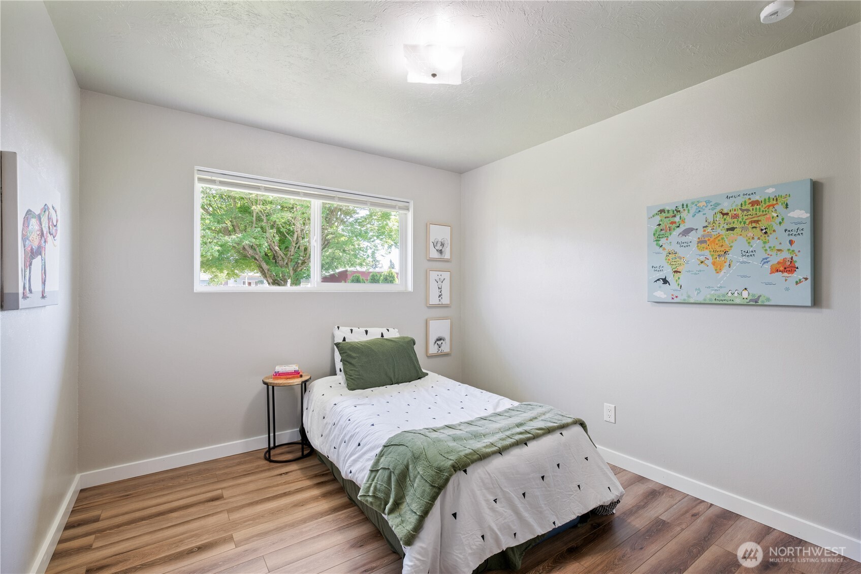 2943 Magnolia Street Longview, WA 98632 - Photo 19 of 36 a bedroom with a bed and wooden floor