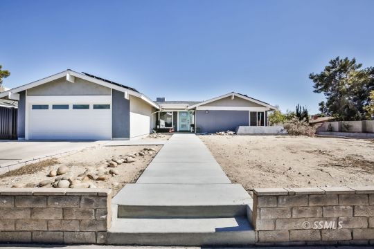 700 Sherri Street Ridgecrest, CA 93555 - Photo 1 of 34 a front view of a house with a yard
