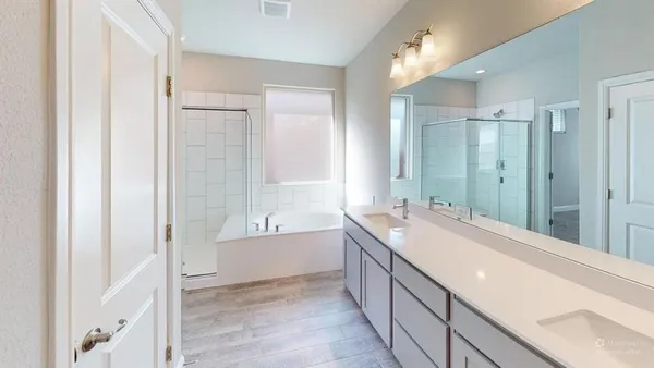 a view of bathroom with a tub sink shower and mirror