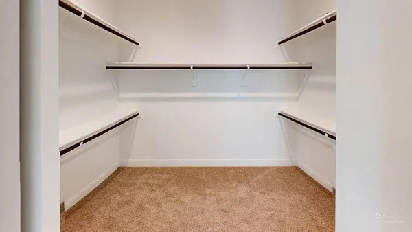 a view of an empty walk in closet