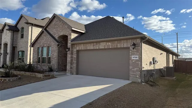a front view of a house with garage