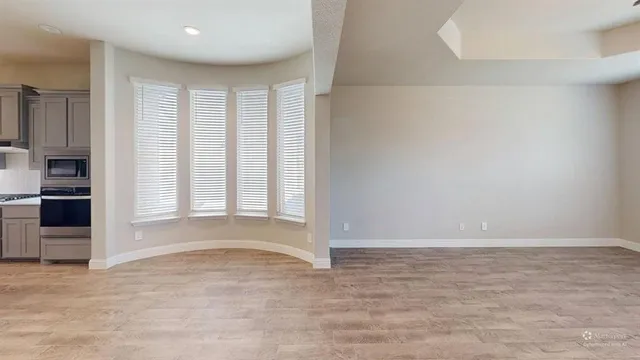 a view of an empty room with a window