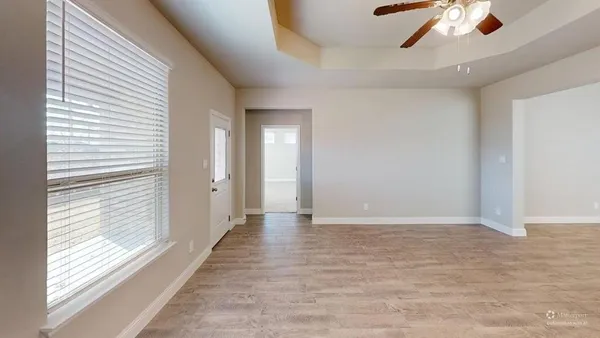 a view of an empty room with a window