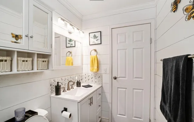 a view of a hallway with wooden floor and stairs