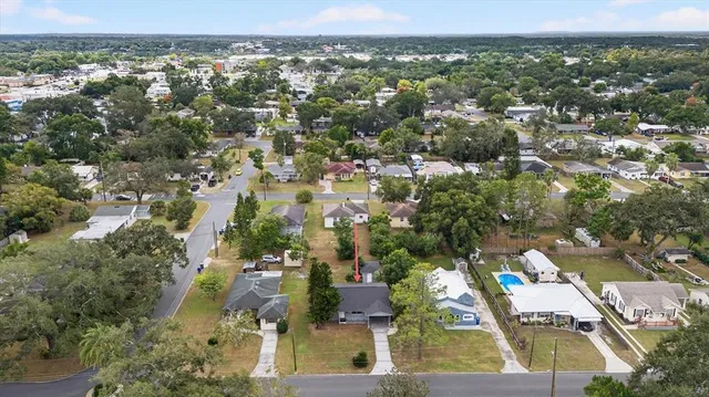 an aerial view of residential houses with outdoor space