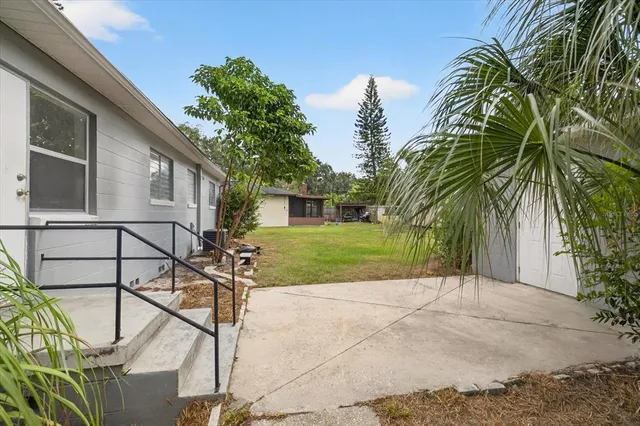 a backyard of a house with seating space