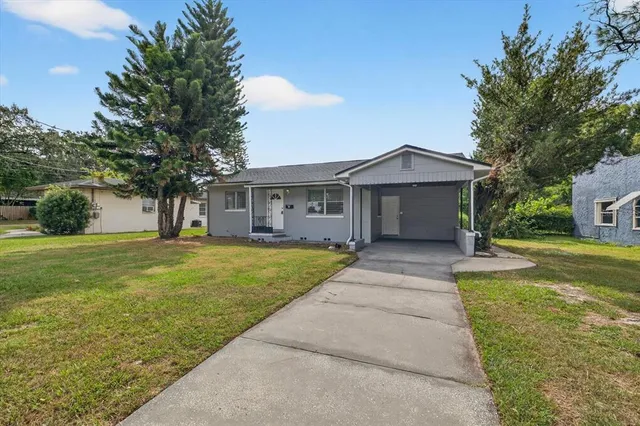 a view of house with a garden