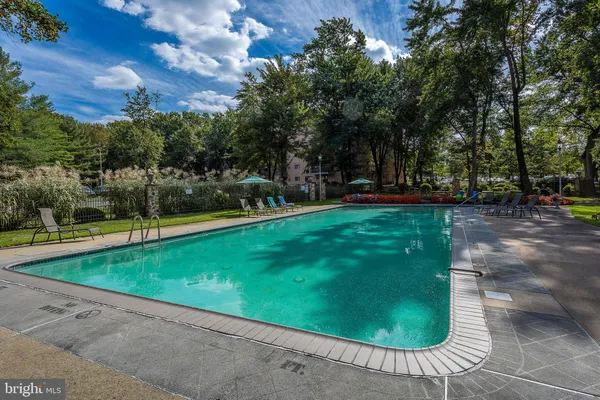 a view of a swimming pool with a patio