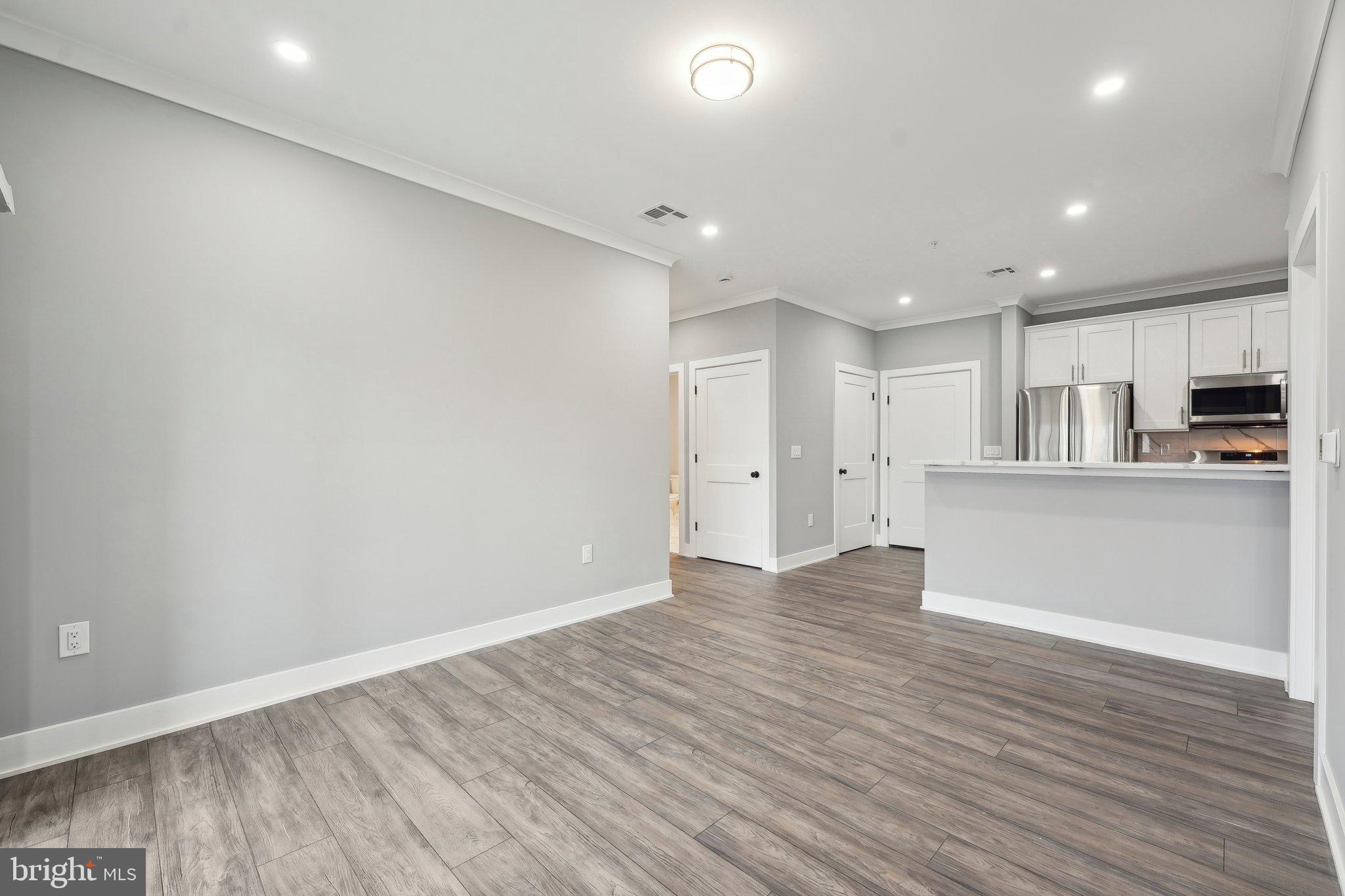 2421 Bristol Road, Unit 302 Warrington, PA 18976 - Photo 3 of 19 a view of kitchen with wooden floor