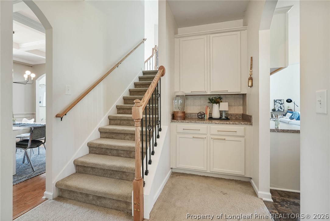 1219 Coachman Way Sanford, NC 27332 - Photo 18 of 46 a kitchen with white cabinets and white appliances