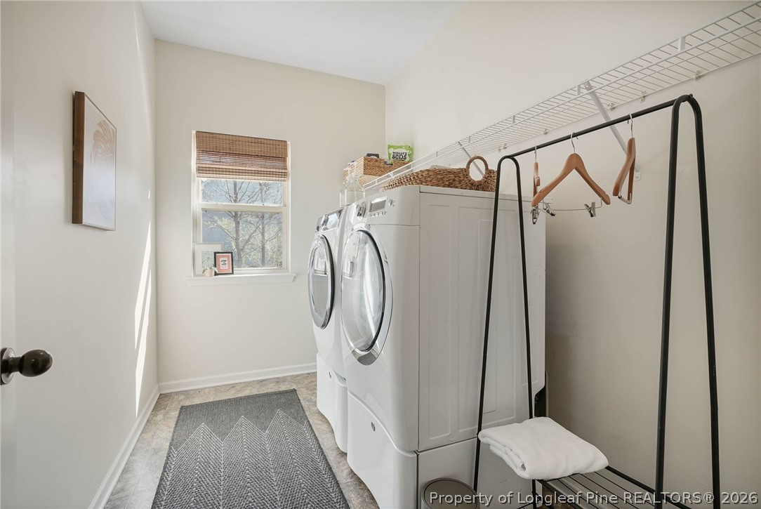 1219 Coachman Way Sanford, NC 27332 - Photo 22 of 46 a bathroom with a granite countertop sink toilet and shower