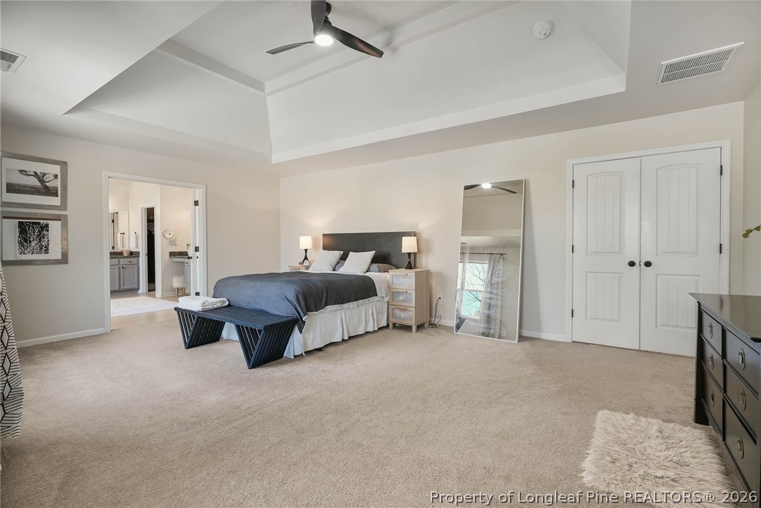 1219 Coachman Way Sanford, NC 27332 - Photo 23 of 46 a spacious bedroom with a bed and ceiling fan