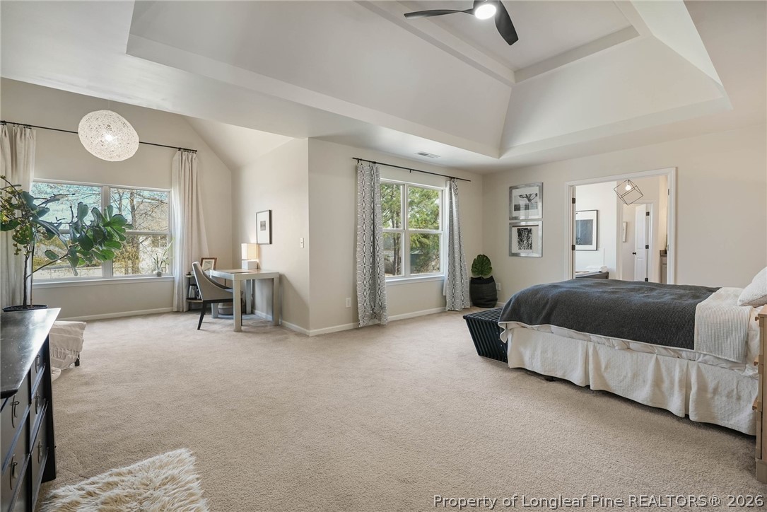 1219 Coachman Way Sanford, NC 27332 - Photo 24 of 46 a spacious bedroom with a bed a table and chair