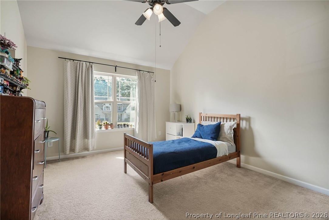 1219 Coachman Way Sanford, NC 27332 - Photo 29 of 46 a living room with a bed furniture and a flat tv screen