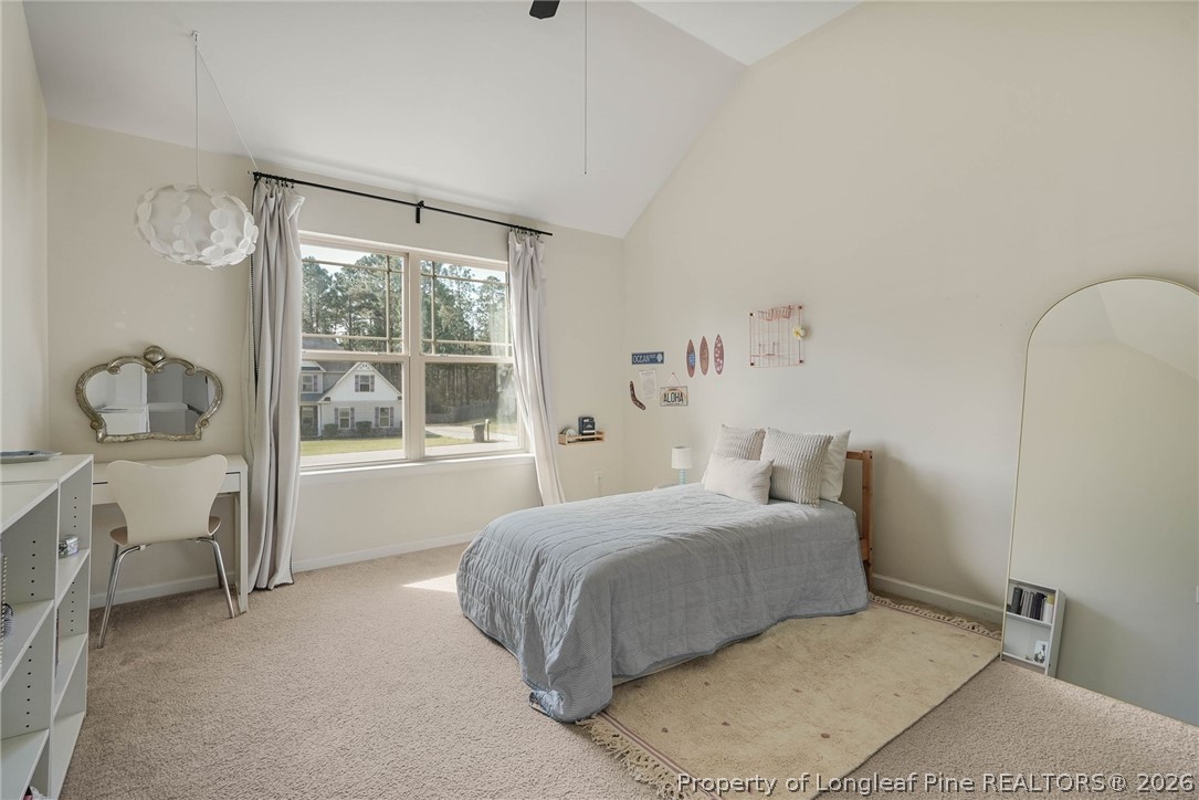 1219 Coachman Way Sanford, NC 27332 - Photo 35 of 46 a bedroom with a bed and a window