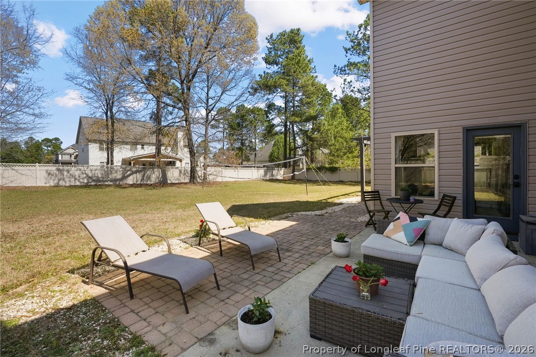 1219 Coachman Way Sanford, NC 27332 - Photo 39 of 46 a view of a swimming pool with lounge chairs in front of house