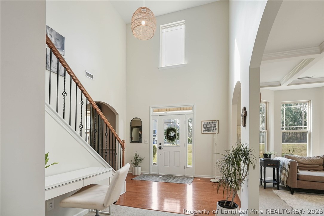 1219 Coachman Way Sanford, NC 27332 - Photo 5 of 46 a view of entryway and hall with wooden floor
