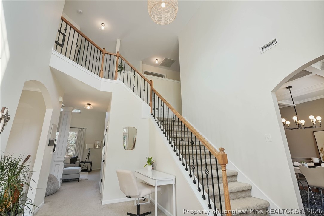 1219 Coachman Way Sanford, NC 27332 - Photo 6 of 46 a view of entryway and hall with wooden floor