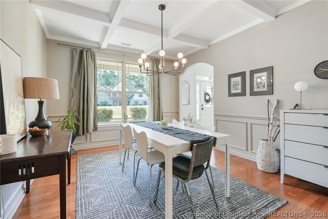 1219 Coachman Way Sanford, NC 27332 - Photo 8 of 46 a view of a dining room with furniture window and wooden floor
