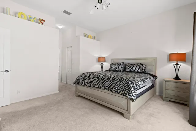 a spacious bathroom with 2 bathtub sink and a mirror