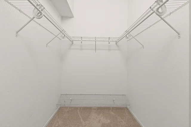 a view of room with furniture and lamp