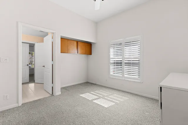 a backyard of a house with lots of green space and lake view