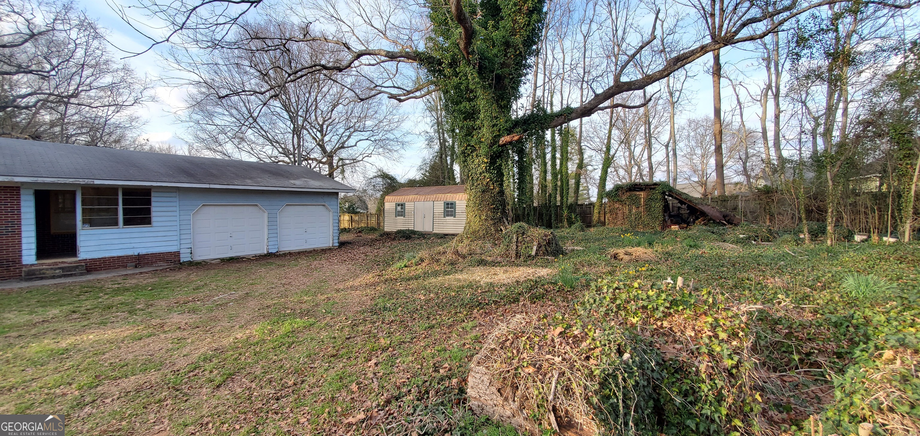 1061 Burger Road Watkinsville, GA 30677 - Photo 26 of 43 a backyard of a house with lots of green space