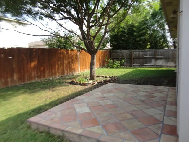 a view of backyard with green space