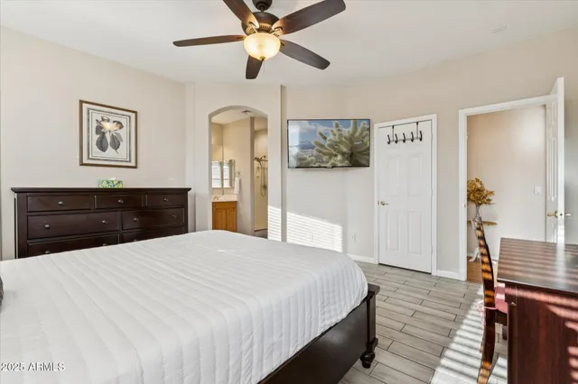 a bedroom with a bed and a dresser