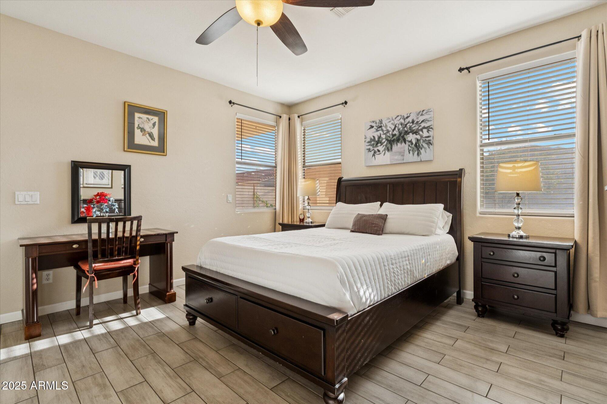 6848 South 27th Street Phoenix, AZ 85042 - Photo 14 of 28 a bed room with a bed and a table