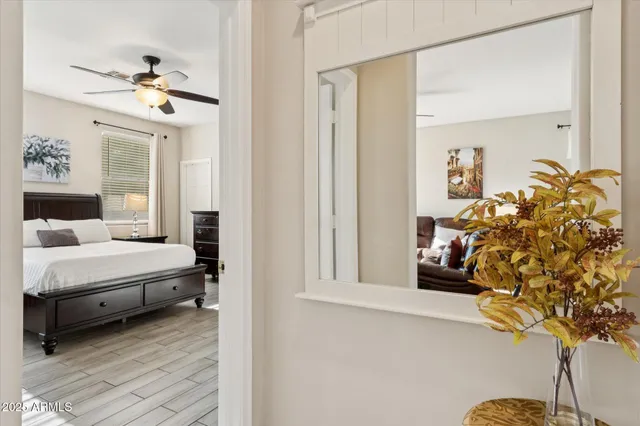 a bedroom with bed and a chandelier