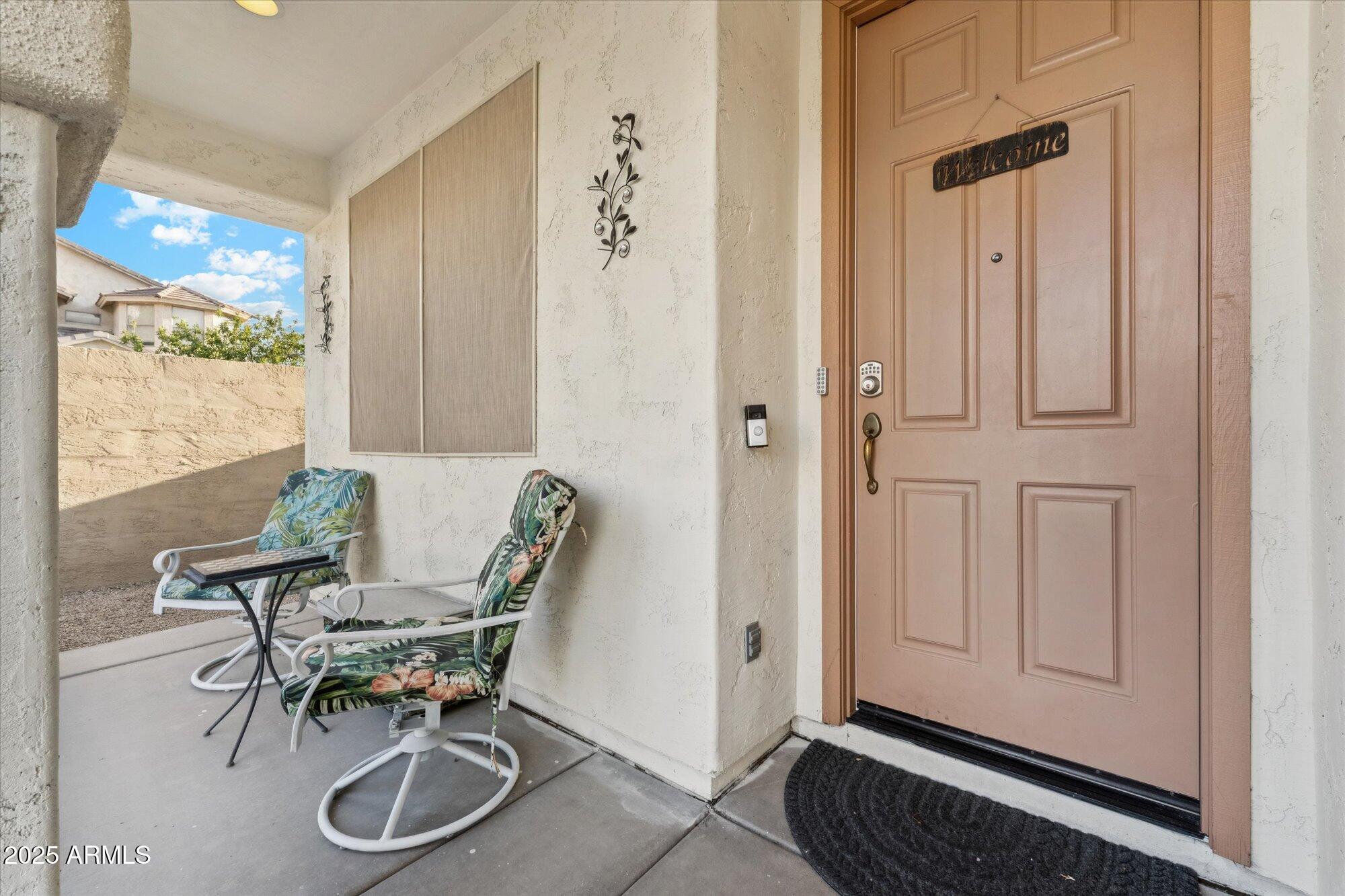 6848 South 27th Street Phoenix, AZ 85042 - Photo 26 of 28 a dining room with furniture and a window