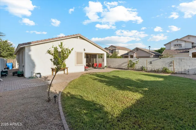 a view of an house with backyard space and garden