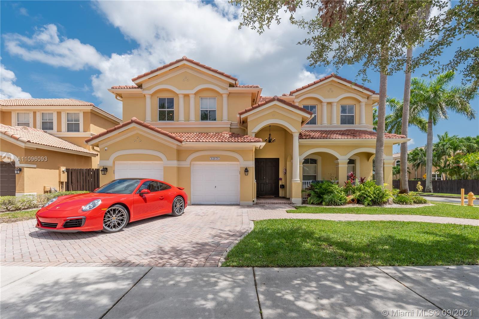 12171 Southwest 122nd Path Miami, FL 33186 - Photo 1 of 16 a front view of a house with a yard