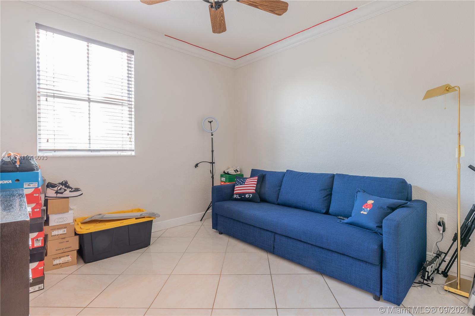 12171 Southwest 122nd Path Miami, FL 33186 - Photo 14 of 16 a living room with furniture and a window